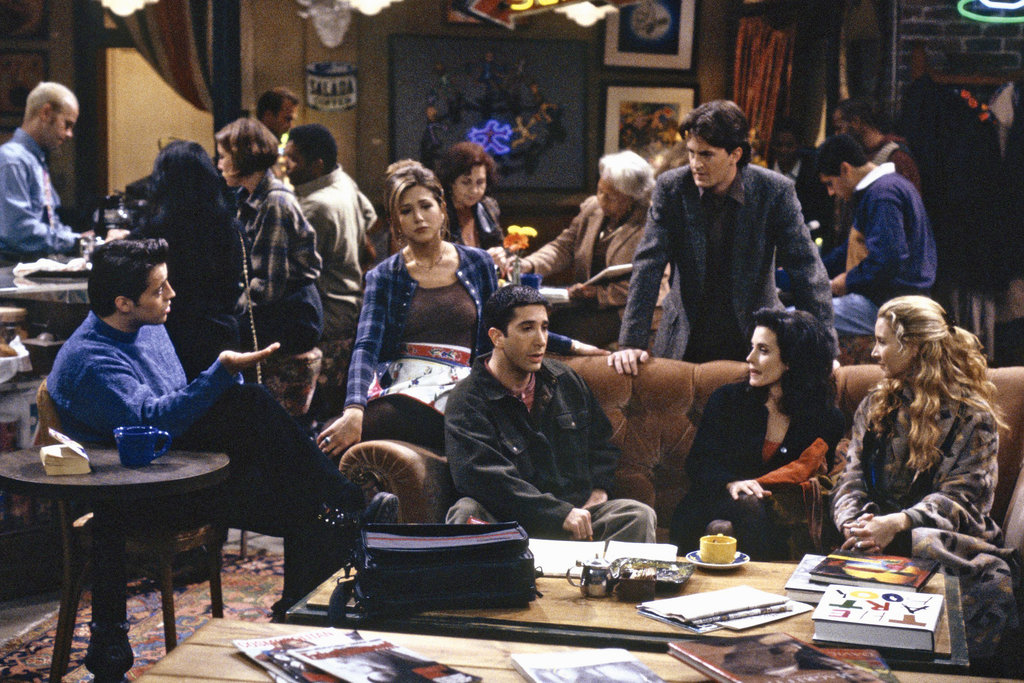 A scene from the Friends television show, with everyone inside the crowded Central Perk cafe